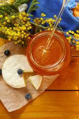 Tasty composition with cheese, honey and berries