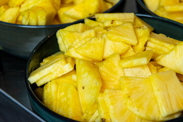 close up of sliced pineapple, healthy food preparation process