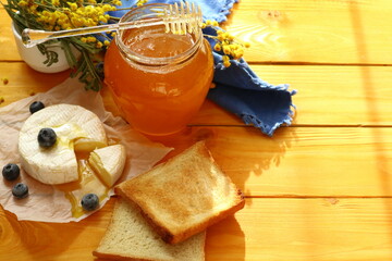 Tasty composition with cheese, honey and berries