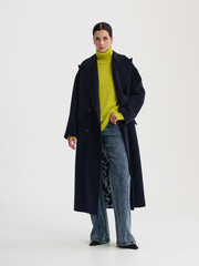 Fashion shooting in studio . Professional model , fashionable clothes and style, new collection. stylish look
