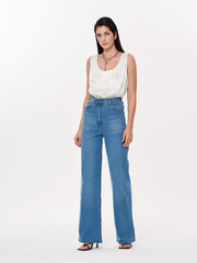 Fashion shooting in studio . Professional model , fashionable clothes and style, new collection. stylish look	