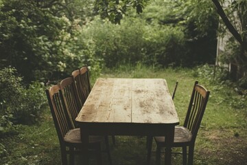 Obraz premium Rustic wooden table and chairs outdoors