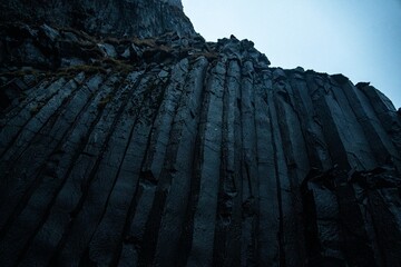 Visitors exploring Reynisfjara volcanic black beach