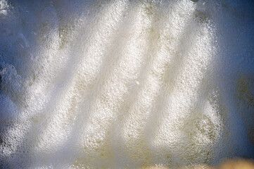 Breathtaking views of crystal clear water flowing through a picturesque mountain stream. Enjoy the mesmerizing beauty of the natural cascade. Calm and serene journey