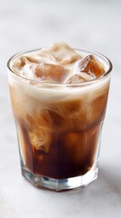 Iced Coffee Served With Milk in a Clear Glass on a Light Background