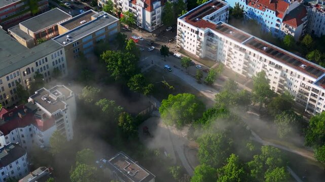Rescue helicopter landing in Berlin urban park. Lovely aerial view flight drone