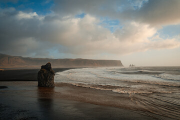Visitors exploring Reynisfjara volcanic black beach