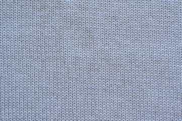Macro texture of gray wool crochet sweater as background, close-up of purple crochet front surface, texture of woolen wool, crochet front surface	
