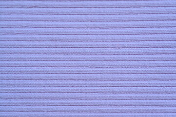 purple texture of knitted synthetic fabric as a background, pink smooth symmetrical lines of synthetic fabric