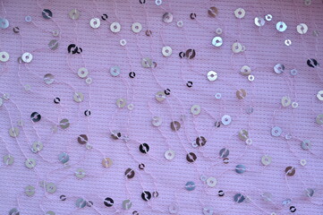 pink fabric with streaky sequins as a background, pink mesh fabric as a background	
