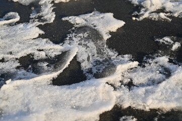 footprints in the snow in the city, ozheliditsya, winter in the city	
