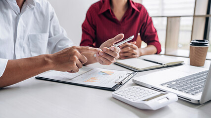 Teamwork of business casual colleagues, consultation new strategy plan business and market growth on financial document graph report, conference to making growth profit, Partner meetings and briefing