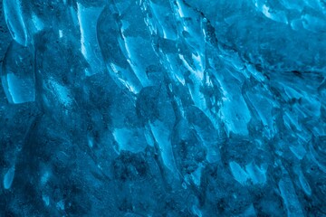 Abstract background of textured blue ice