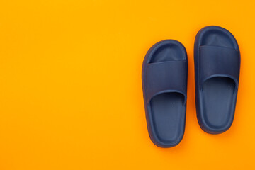 Blue sandals on color background,top view