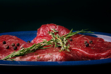 Raw Steaks on Blue Plate