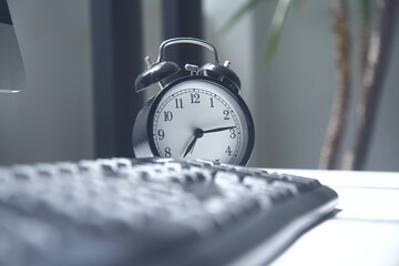 Black alarm clock  and black keyboard