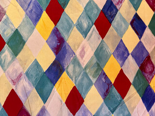 colorful diamond-shaped evergreen pattern background on a canvas