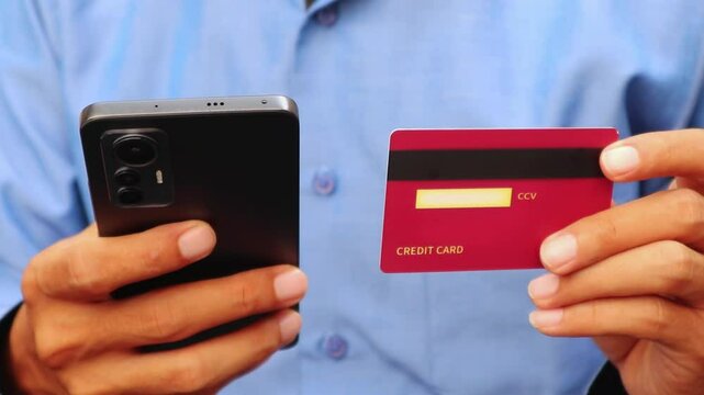 man with credit card and mobil phone
