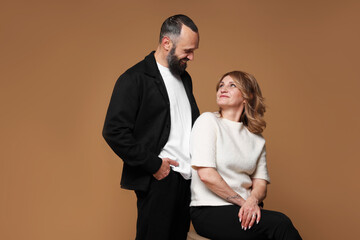 Portrait of lovely couple on brown background