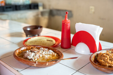 Tatemada birria served at a traditional stall in the central market of Guadalajara, Jalisco, Mexico. abastos, tapatio, chivo