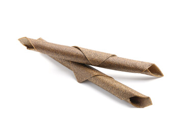 Delicious fruit leather rolls on white background