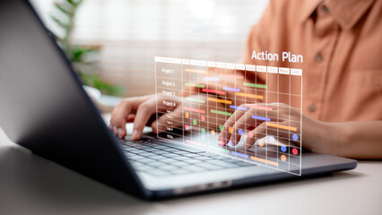 Businessperson managing project timeline on laptop with digital Gantt chart and "Action Plan" label, representing strategic execution, project scheduling, and task tracking in business planning system