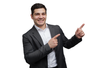 Cheerful young professional pointing enthusiastically in a stylish suit against a clean backdrop