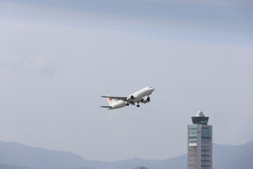 White Aircraft Over the Skies of Fukuoka