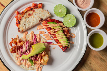 A delightful presentation of unique shrimp tacos garnished with lime, fresh vegetables, and savory sauces, capturing the essence of vibrant Mexican street food culture.