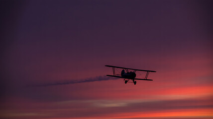 Obraz premium biplane, Biplane flying sunset sky silhouette