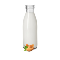 Nut milk in glass bottle and almonds isolated on white