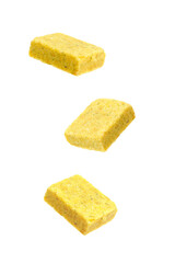 Bouillon cubes in air on white background