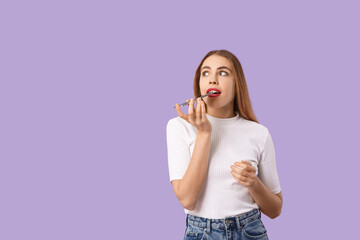 Beautiful woman with mobile phone sending voice message on purple background