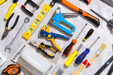 Arrangement of construction tools on white grunge background