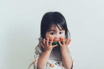 Cute Little Girl Eating Watermelon in Summer