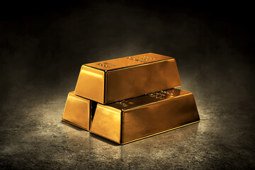 Stack of shiny gold bars on dark background
