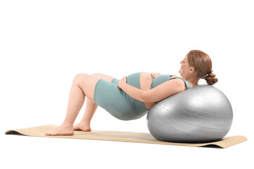 Fototapeta premium Sporty pregnant woman training with fitball on white background