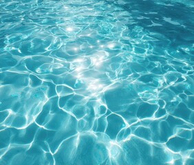 Obraz premium Sunlit turquoise water displays gentle ripples and shimmering reflections