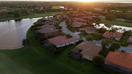 Naklejka premium lush green golfing fairways at sunset in River Strand golf community, Bradenton, Florida