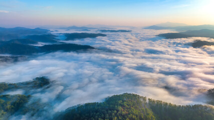 Aerial view of the Cau Dat suburbs near Da Lat city at morning with misty sky in Vietnam highlands