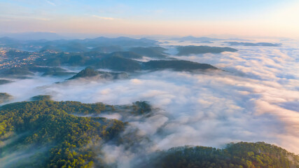 Aerial view of the Cau Dat suburbs near Da Lat city at morning with misty sky in Vietnam highlands