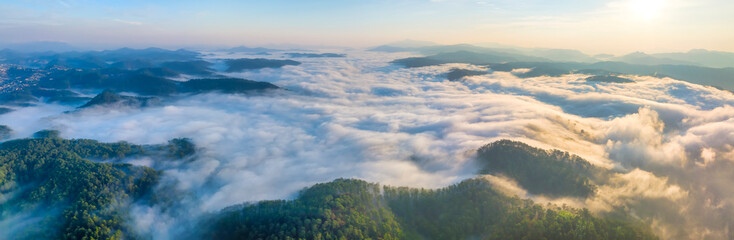 Aerial view of the Cau Dat suburbs near Da Lat city at morning with misty sky in Vietnam highlands