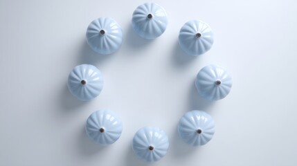 Pastel blue circular decorative elements in flat lay, conveying harmony and delicate elegance
