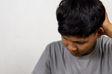 Portrait Of Depressed Young Indonesian Man, Suffering Life Problems Or Mental Breakdown, Feeling Despair, Copy Space