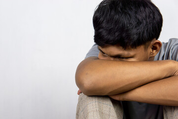 Portrait Of Depressed Young Indonesian Man, Suffering Life Problems Or Mental Breakdown, Feeling Despair, Copy Space