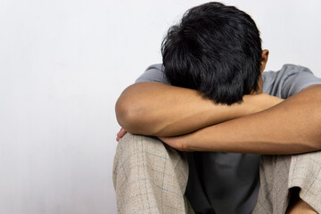 Portrait Of Depressed Young Indonesian Man, Suffering Life Problems Or Mental Breakdown, Feeling Despair, Copy Space