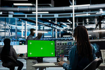 IT specialist in server hub using mockup PC to fix errors slowing down hardware. System...