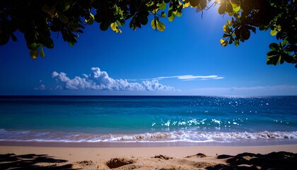 日陰から見える白い砂浜と青い海と空