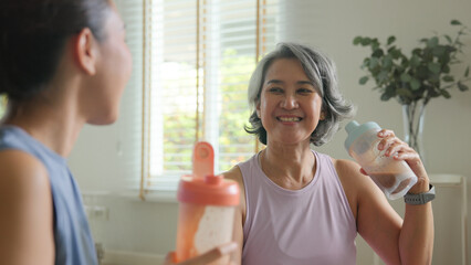 Young adult child active mature middle age old mum drink whey protein shake bottle diet food after...