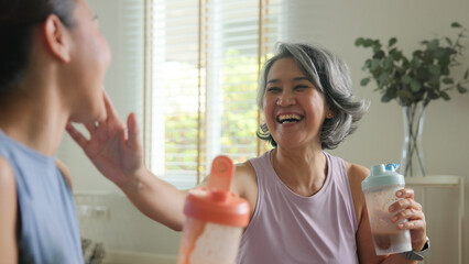 Young adult child active mature middle age old mum drink whey protein shake bottle diet food after...